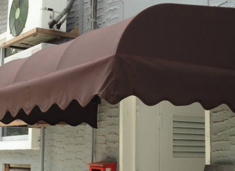 Canvas canopy awning installed on building