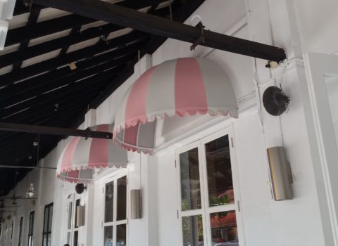 Canvas canopy awning installed on building exterior
