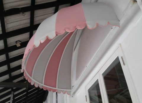 Canvas canopy awning installed on building exterior